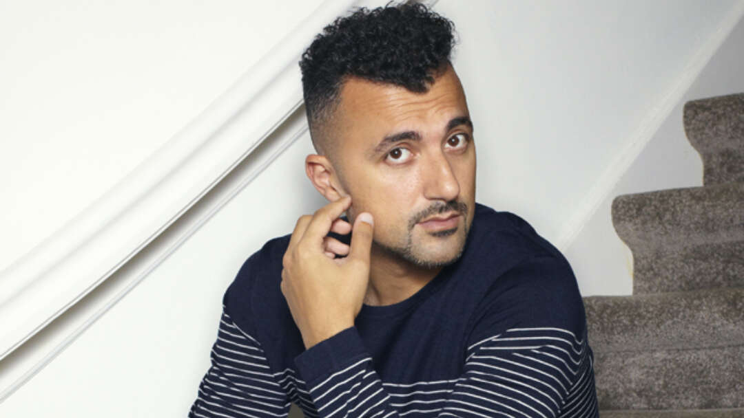 Özcan Akyol sitting on stairs